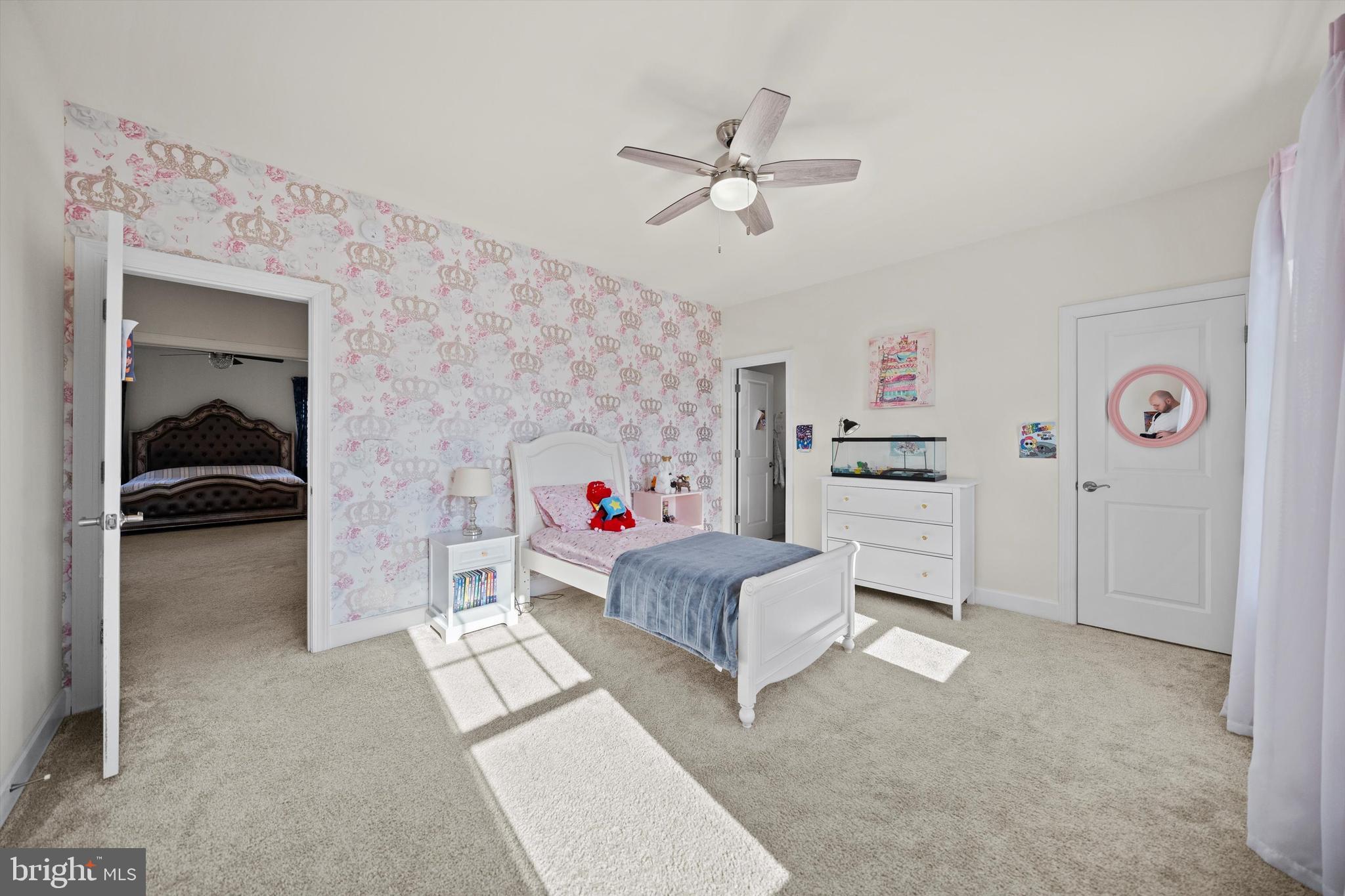 8690 Belle Grove Way Manassas, VA 20110 - Photo 33 of 55 a living room with furniture and a baby crib
