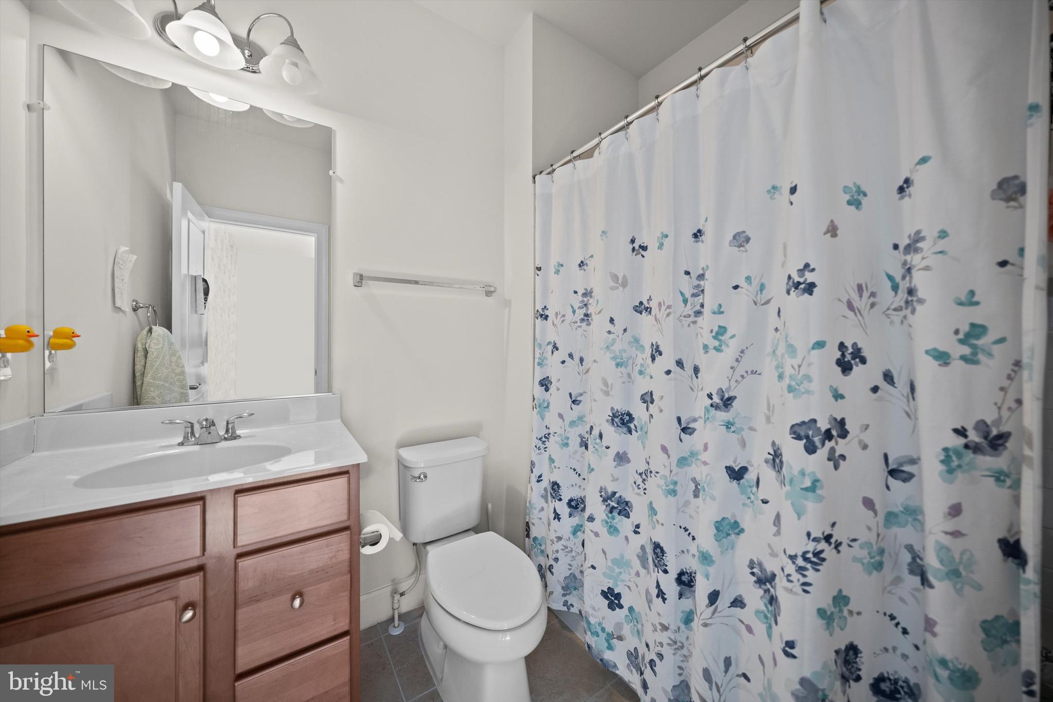 8690 Belle Grove Way Manassas, VA 20110 - Photo 34 of 55 a bathroom with a granite countertop sink mirror vanity and toilet