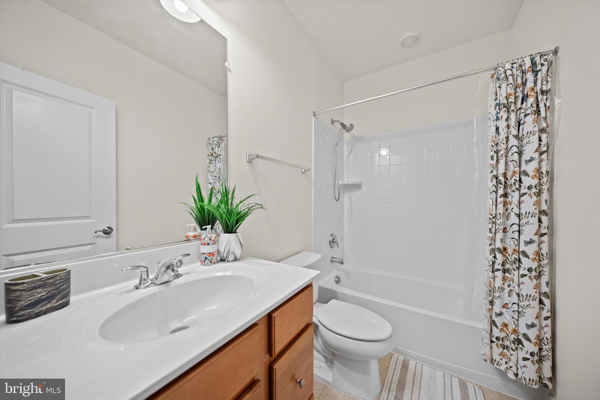 8690 Belle Grove Way Manassas, VA 20110 - Photo 37 of 55 a bathroom with a sink toilet and shower