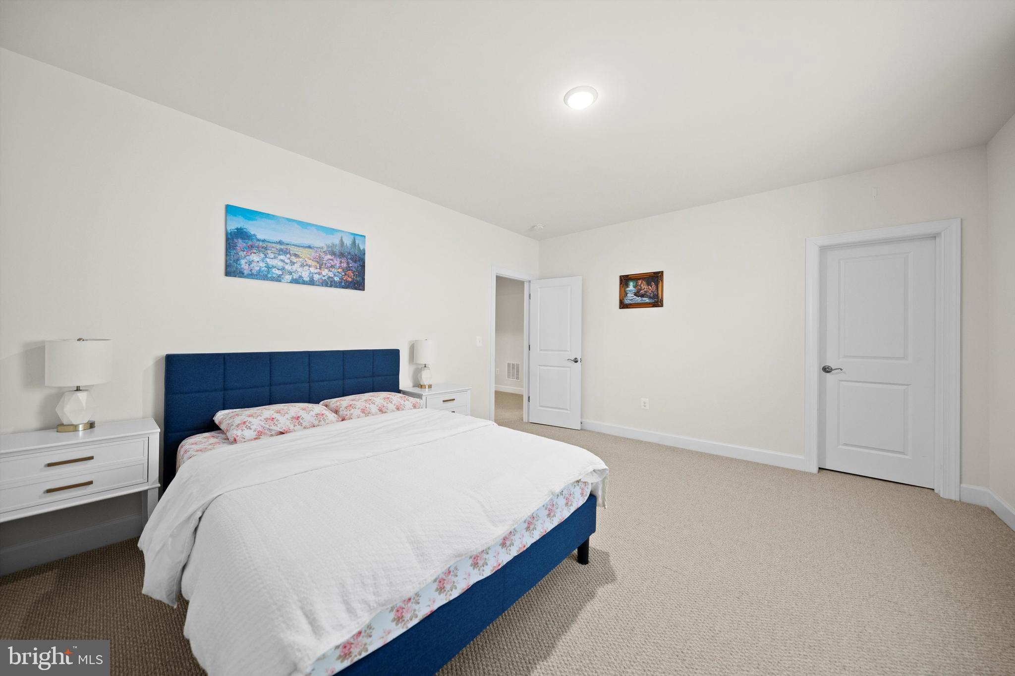 8690 Belle Grove Way Manassas, VA 20110 - Photo 38 of 55 a bed sitting in a bedroom and a table