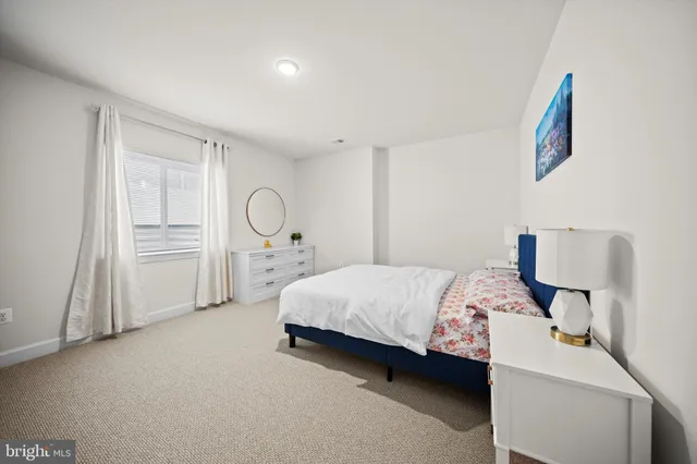 a bed room with a bed and dresser