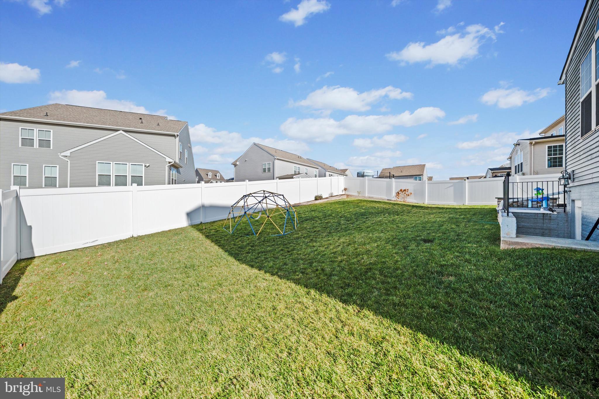 8690 Belle Grove Way Manassas, VA 20110 - Photo 42 of 55 a view of a house with a big yard and large trees