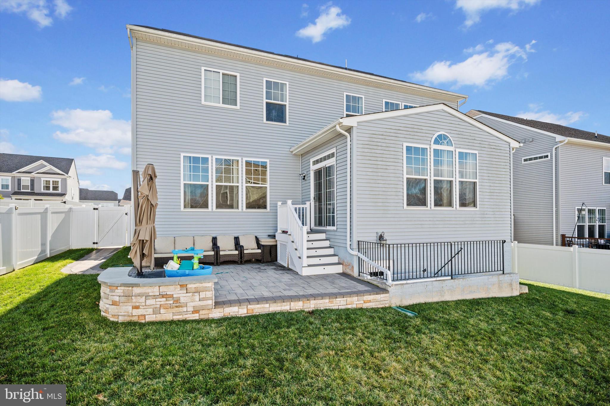 8690 Belle Grove Way Manassas, VA 20110 - Photo 43 of 55 a front view of a house with a yard