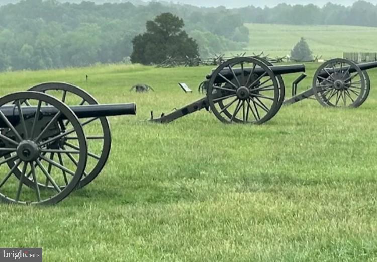 8690 Belle Grove Way Manassas, VA 20110 - Photo 48 of 55 a view of a table and chairs in the garden