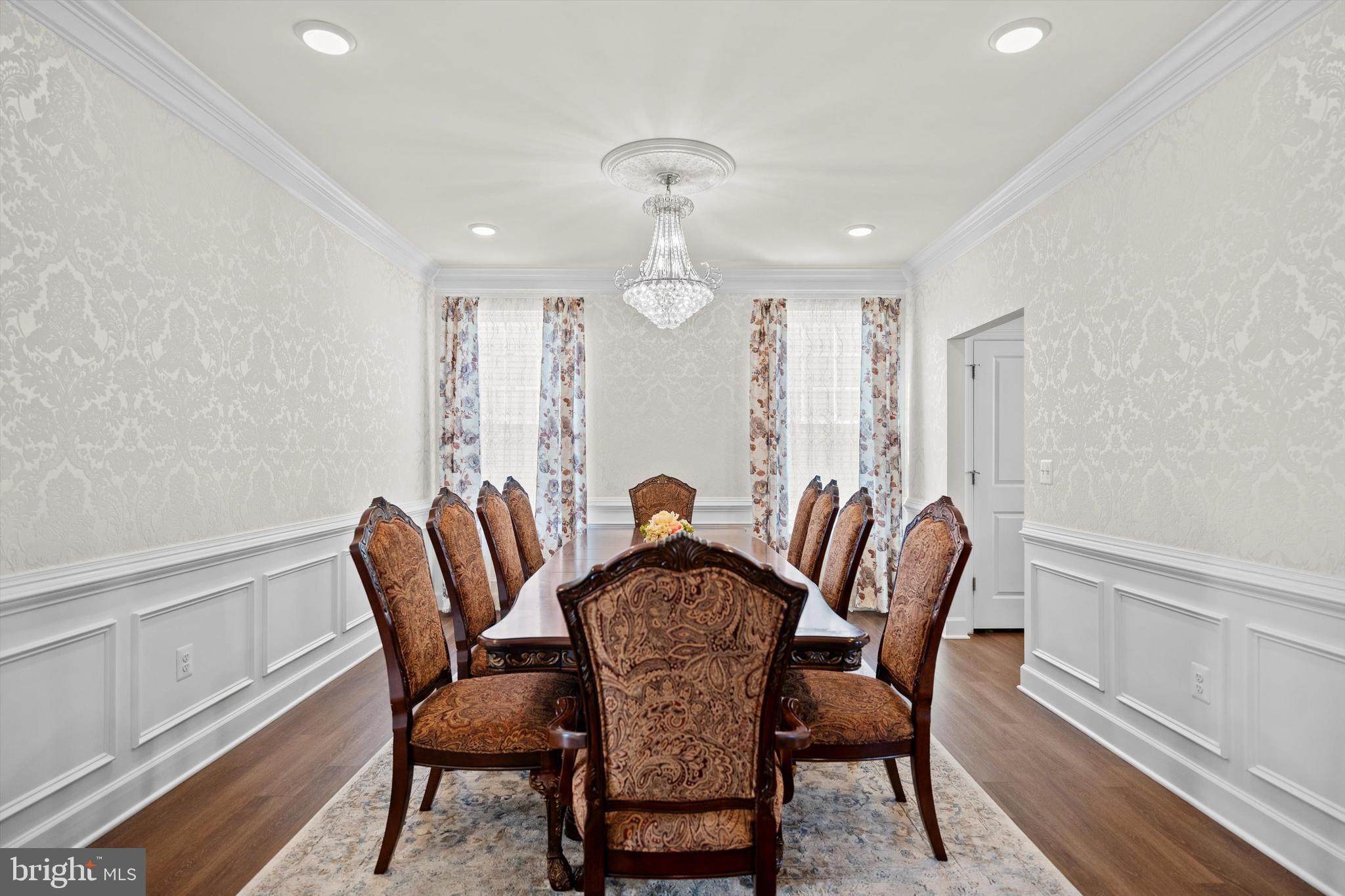 8690 Belle Grove Way Manassas, VA 20110 - Photo 7 of 55 a view of a dining room with furniture window and wooden floor