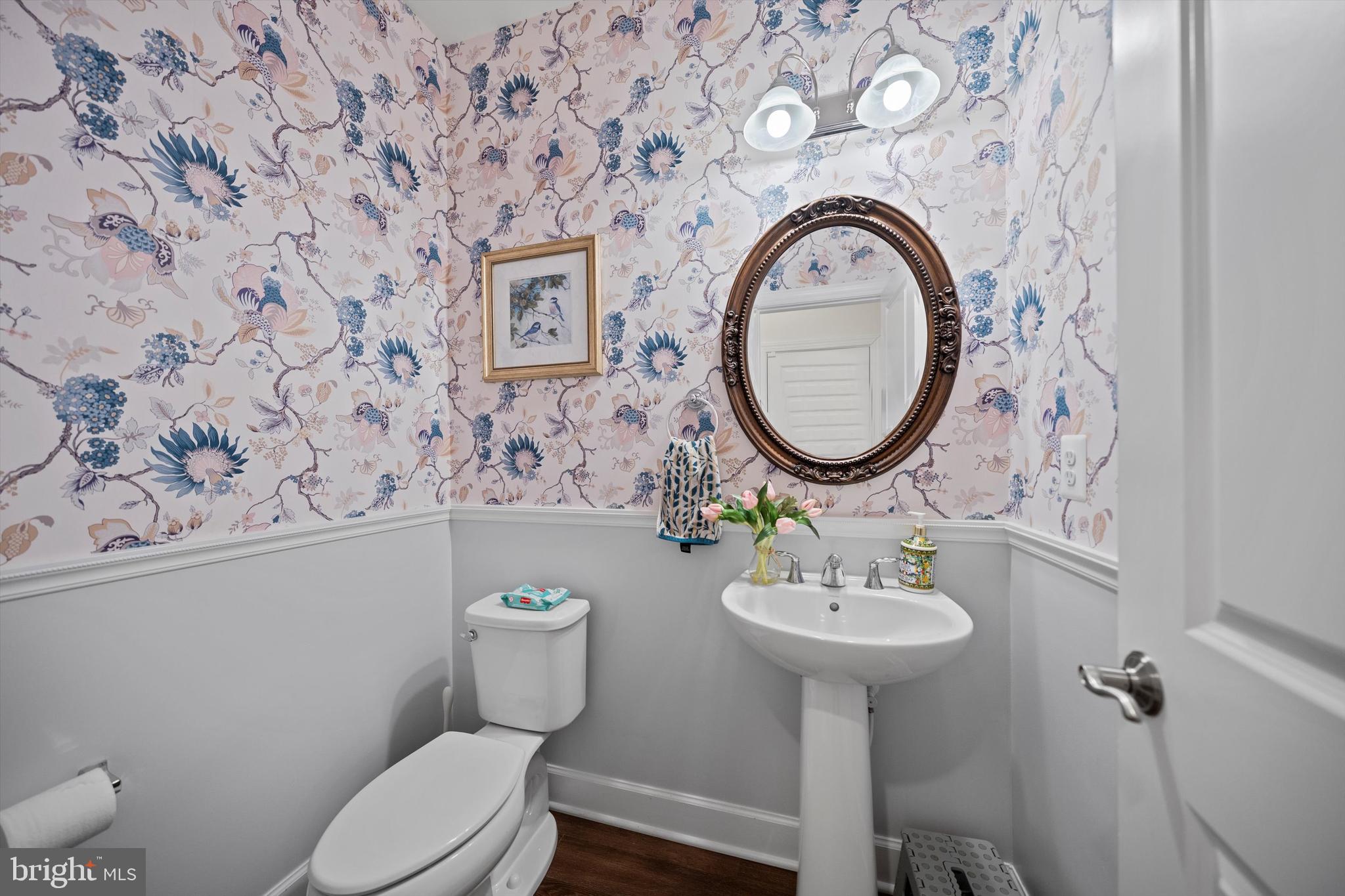 8690 Belle Grove Way Manassas, VA 20110 - Photo 8 of 55 a bathroom with a toilet sink and mirror