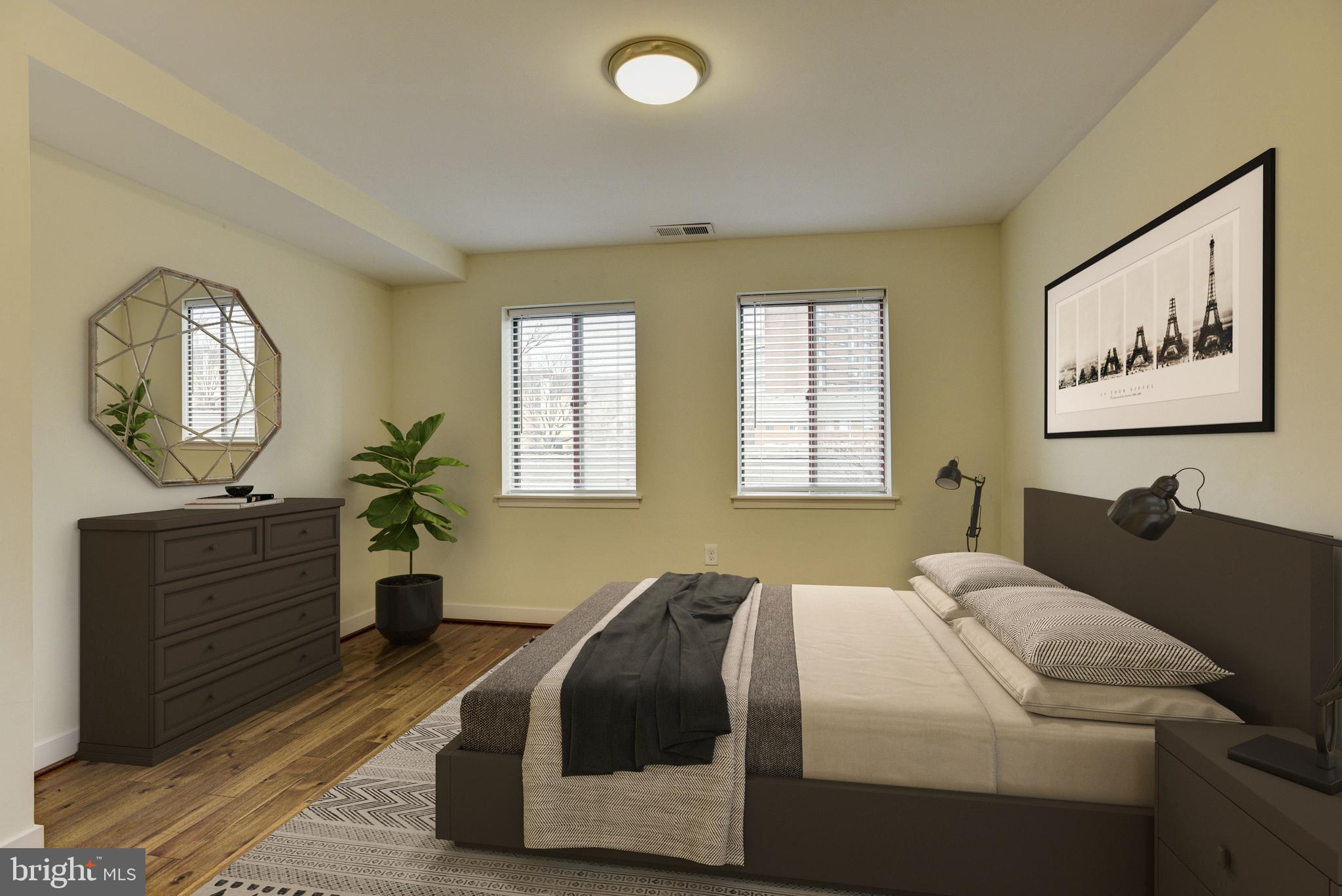 10 West Lee Street, Unit R71 Baltimore, MD 21201 - Photo 14 of 28 Primary Bedroom Suite Staged Using Virtual Tools