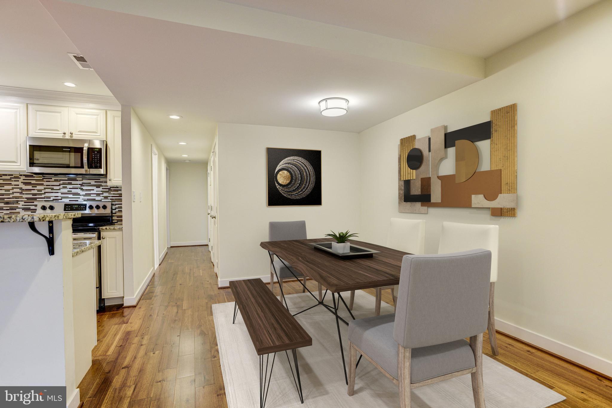 10 West Lee Street, Unit R71 Baltimore, MD 21201 - Photo 7 of 28 Dining Area Staged Using Virtual Tools