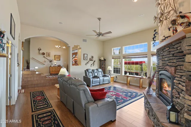an outdoor sitting area with furniture and pool view