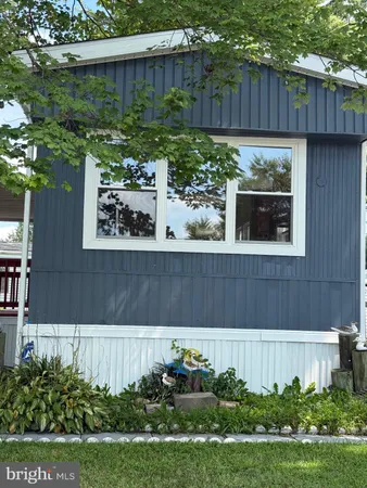 a house with lots of trees in the background