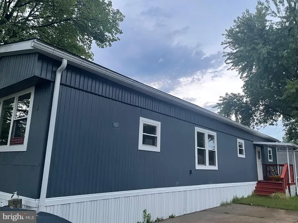 a house with a tree in the background