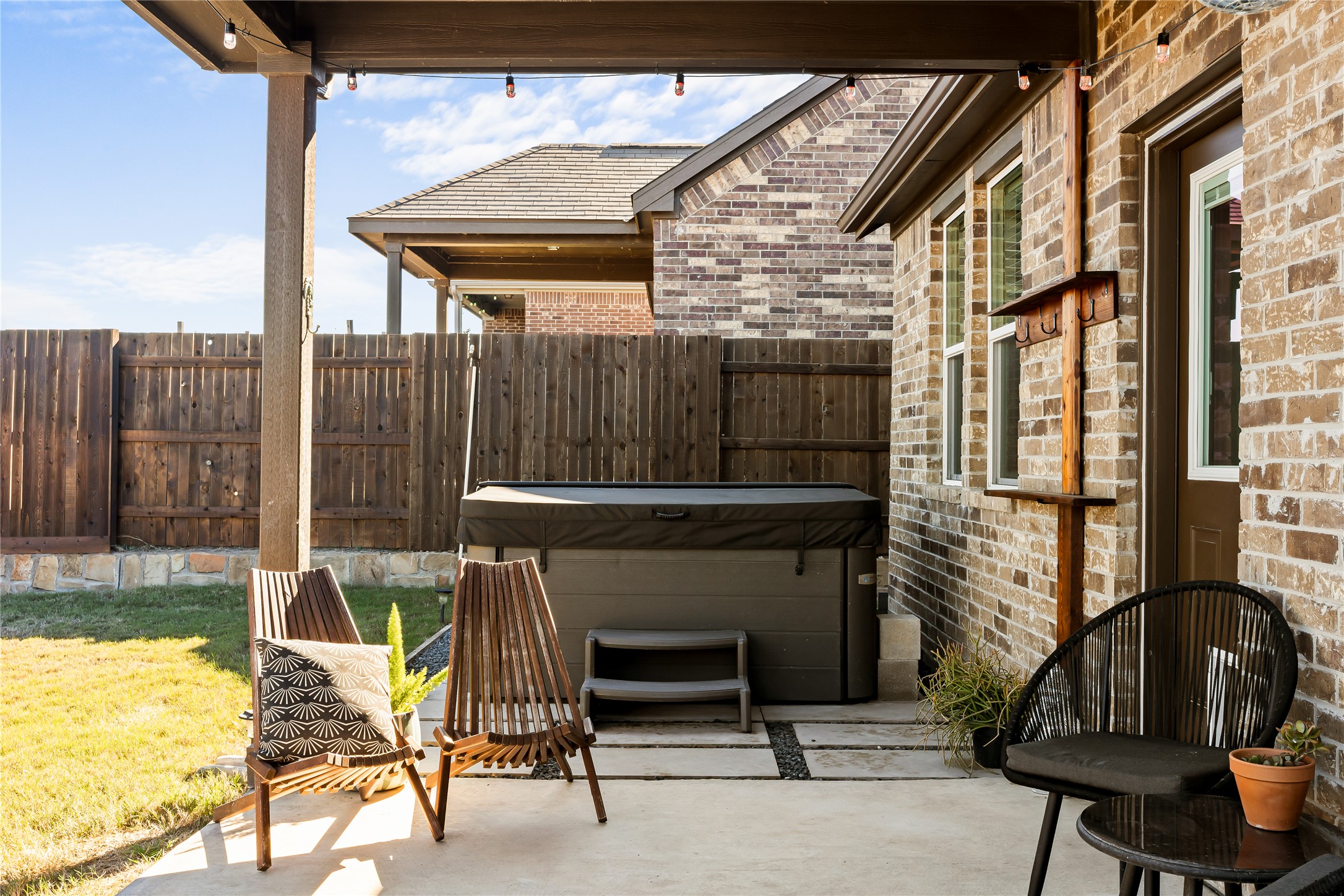 862 Pepperbark Loop Buda, TX 78610 - Photo 33 of 40 a view of balcony with two chairs and a barbeque