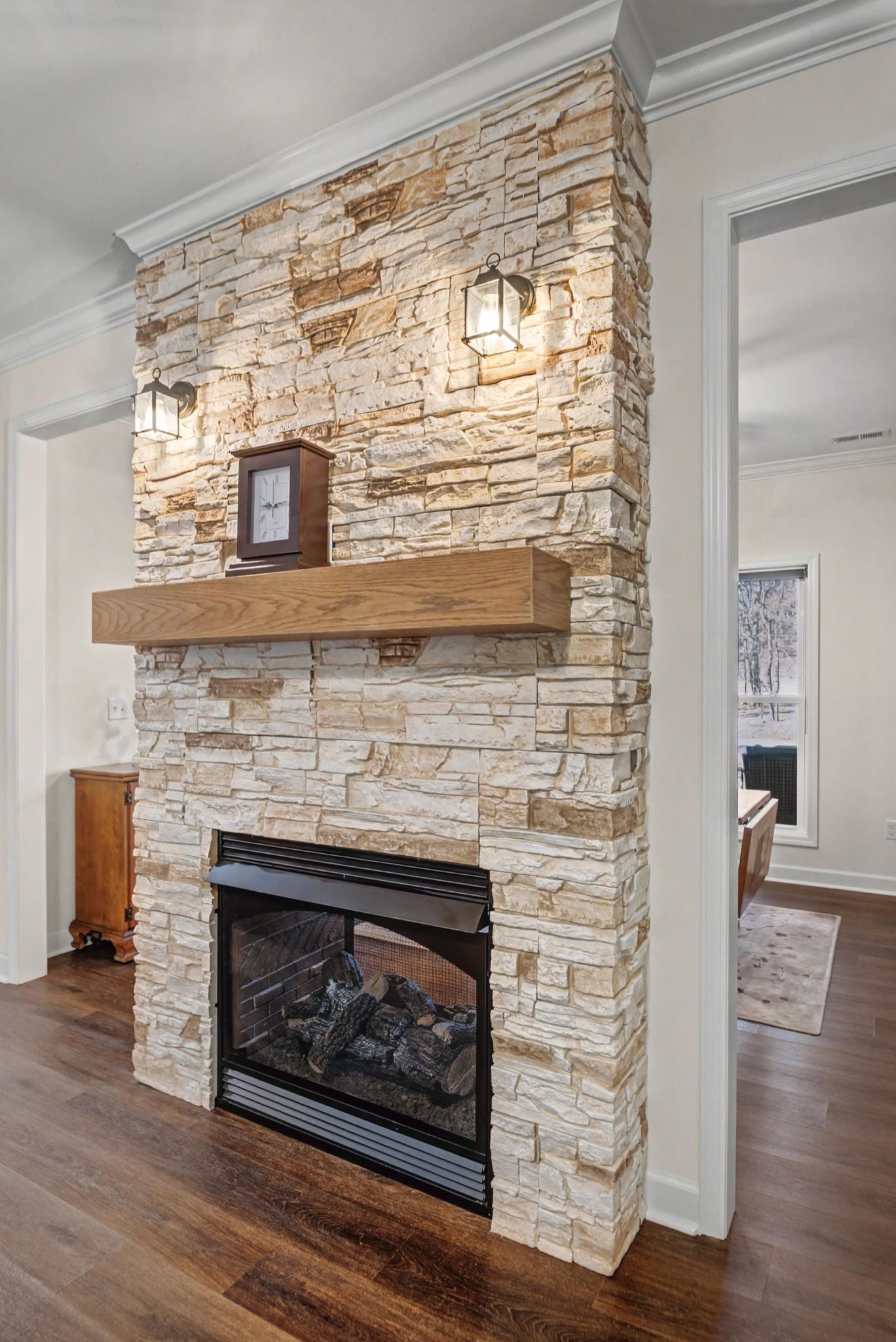 765 Scenic Circle Pulaski, TN 38478 - Photo 18 of 46 a living room with a fireplace and a wooden floor