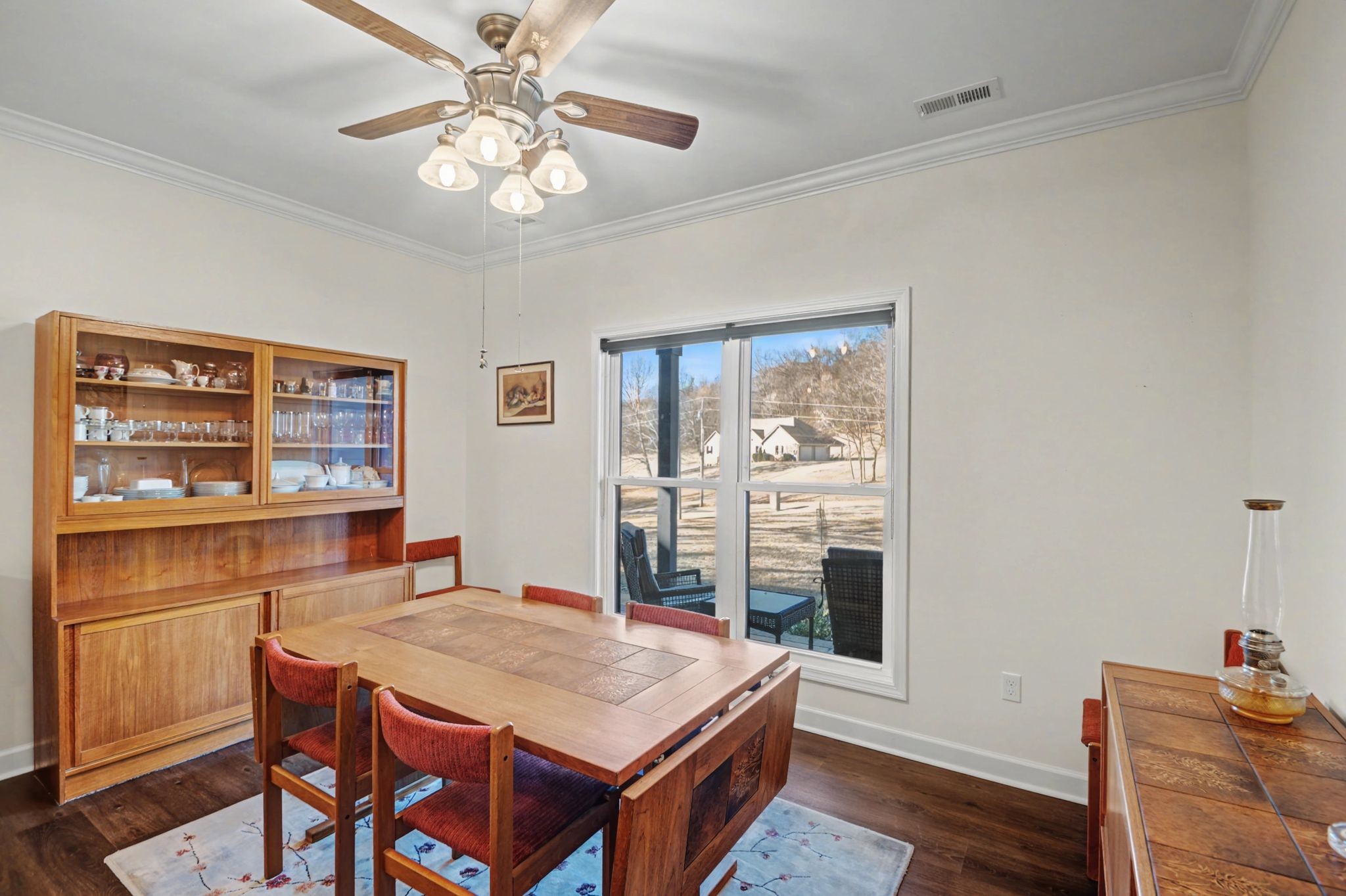 765 Scenic Circle Pulaski, TN 38478 - Photo 20 of 46 a room with a table chairs and wooden floor