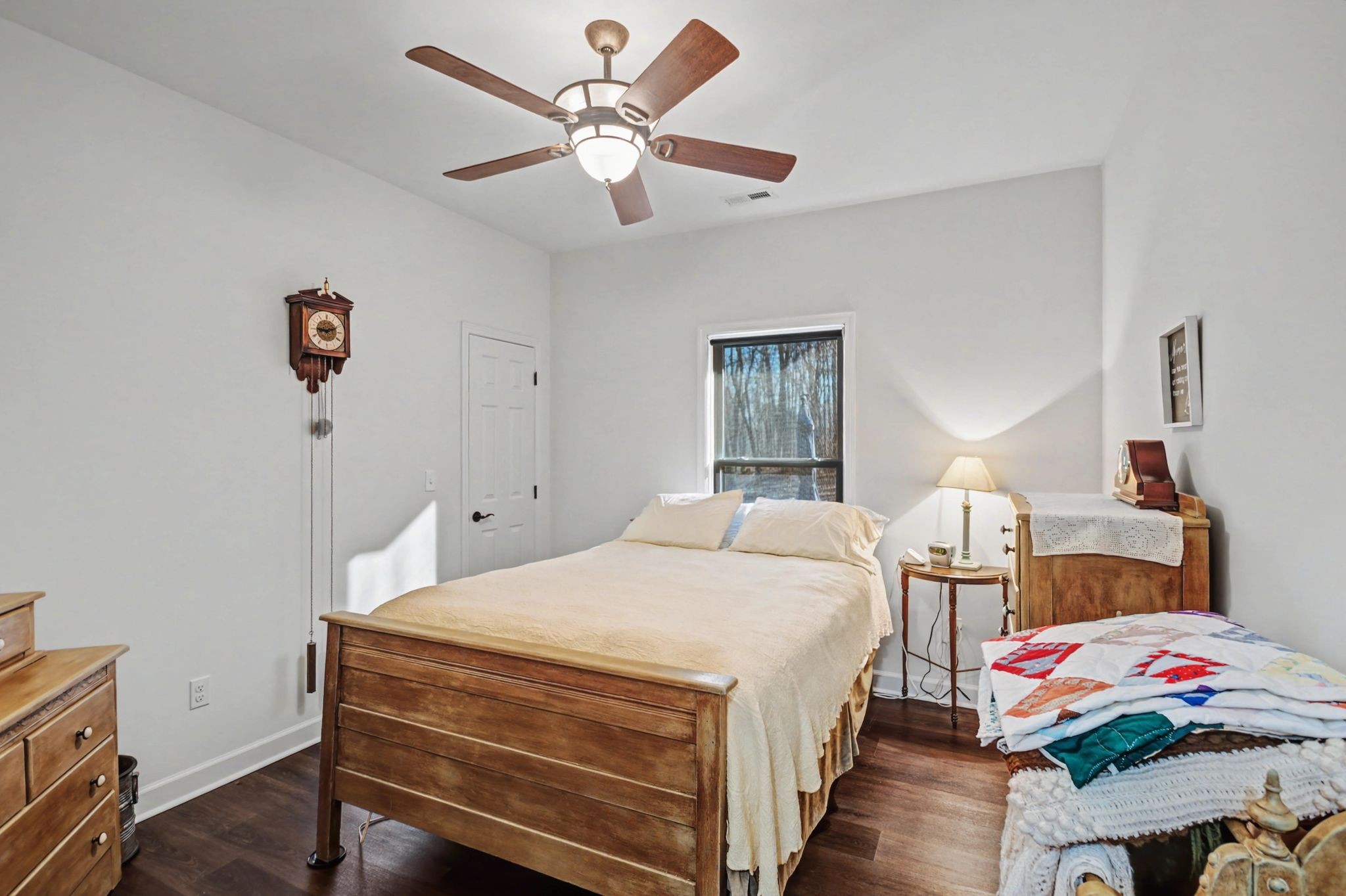 765 Scenic Circle Pulaski, TN 38478 - Photo 28 of 46 a bedroom with a bed and a chandelier