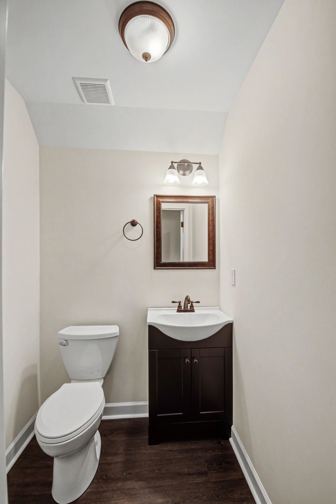 765 Scenic Circle Pulaski, TN 38478 - Photo 40 of 46 a bathroom with a toilet sink and mirror