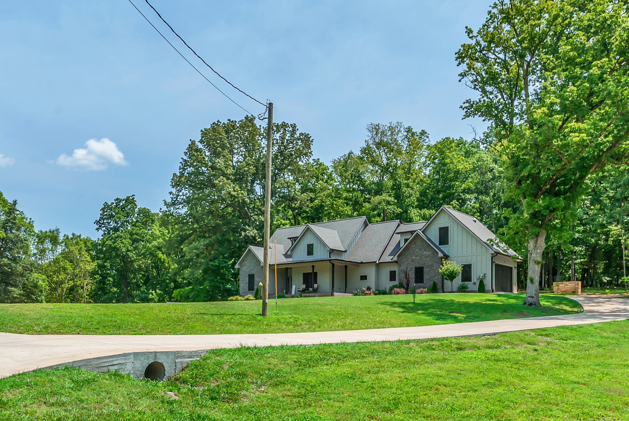 765 Scenic Circle Pulaski, TN 38478 - Photo 4 of 46 a front view of a house with a yard and trees
