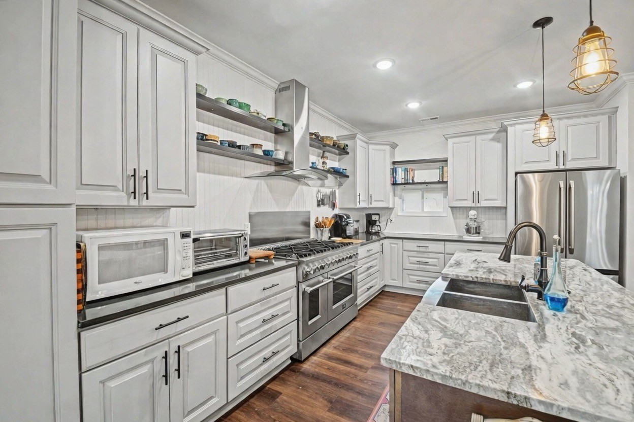 765 Scenic Circle Pulaski, TN 38478 - Photo 10 of 46 a kitchen with stainless steel appliances granite countertop a sink stove and refrigerator