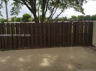 11206 Southwest 125th Place, Unit 11206 Miami, FL 33186 - Photo 12 of 15 a view of wooden fence