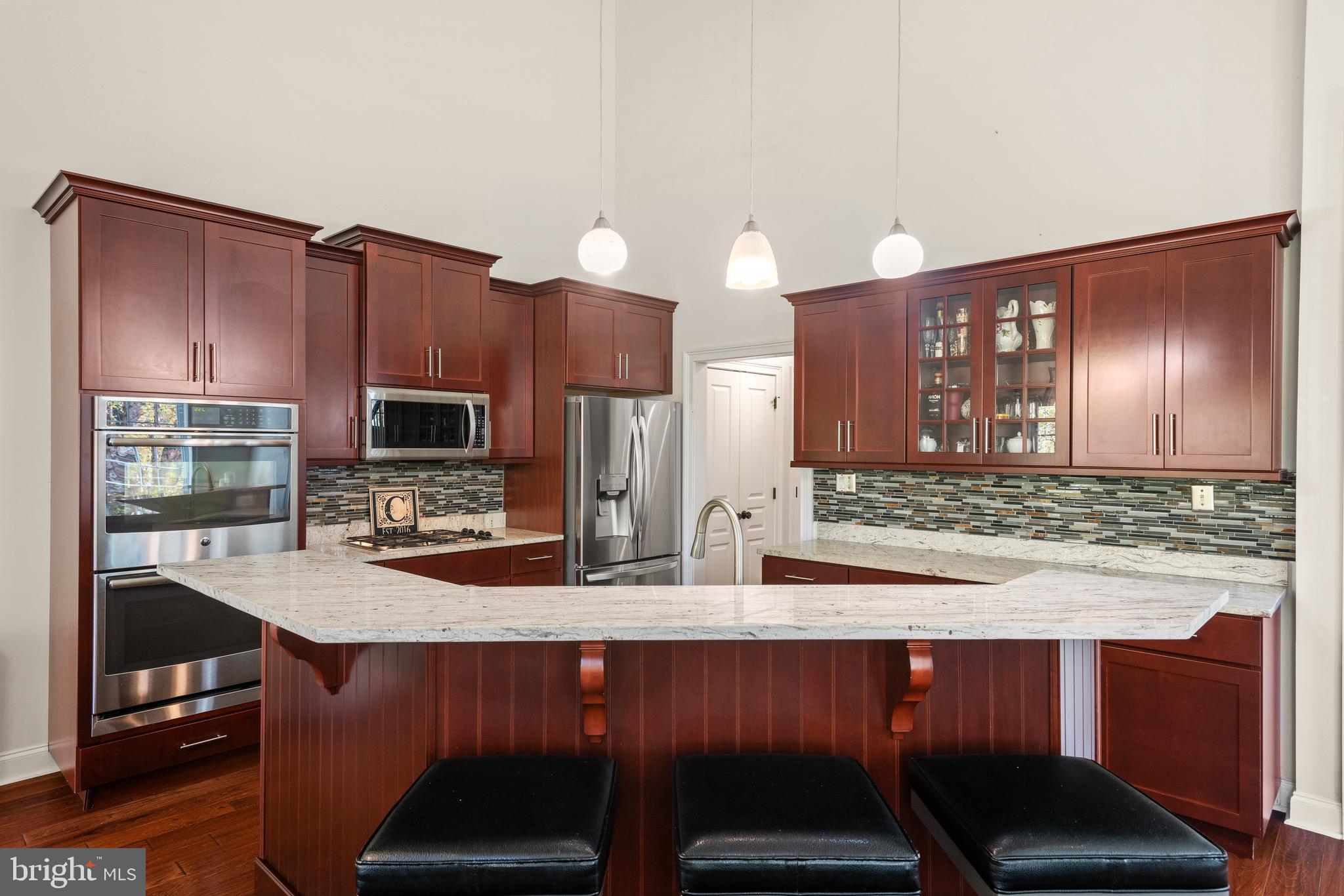 110 Dauphin Drive Springfield, PA 19064 - Photo 13 of 52 a kitchen with a sink cabinets and wooden floor