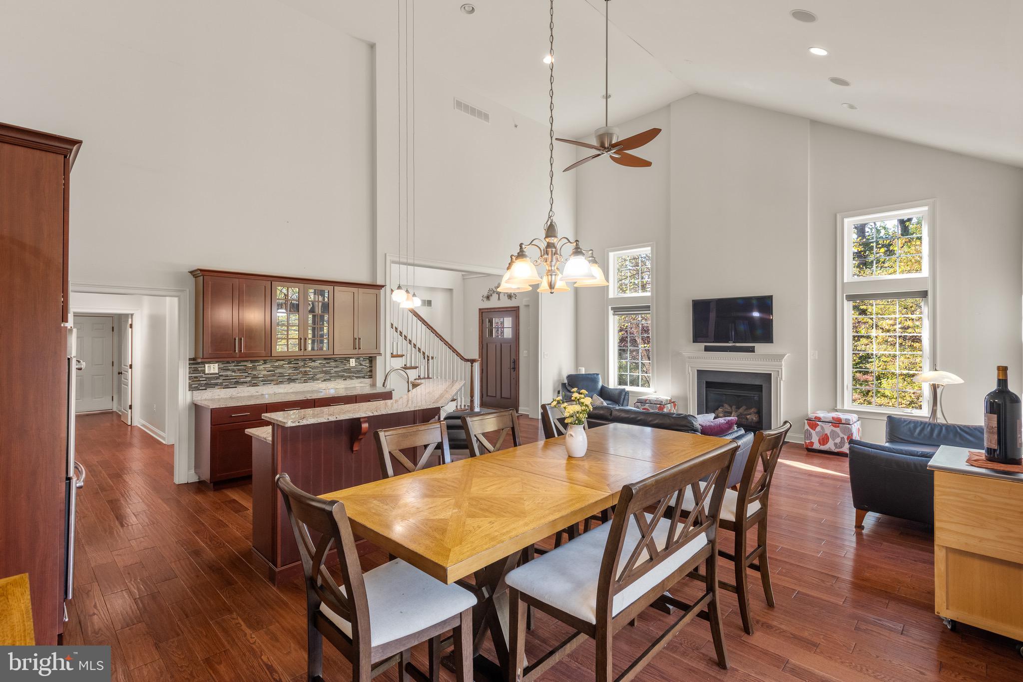 110 Dauphin Drive Springfield, PA 19064 - Photo 16 of 52 a dining room with furniture a chandelier and wooden floor