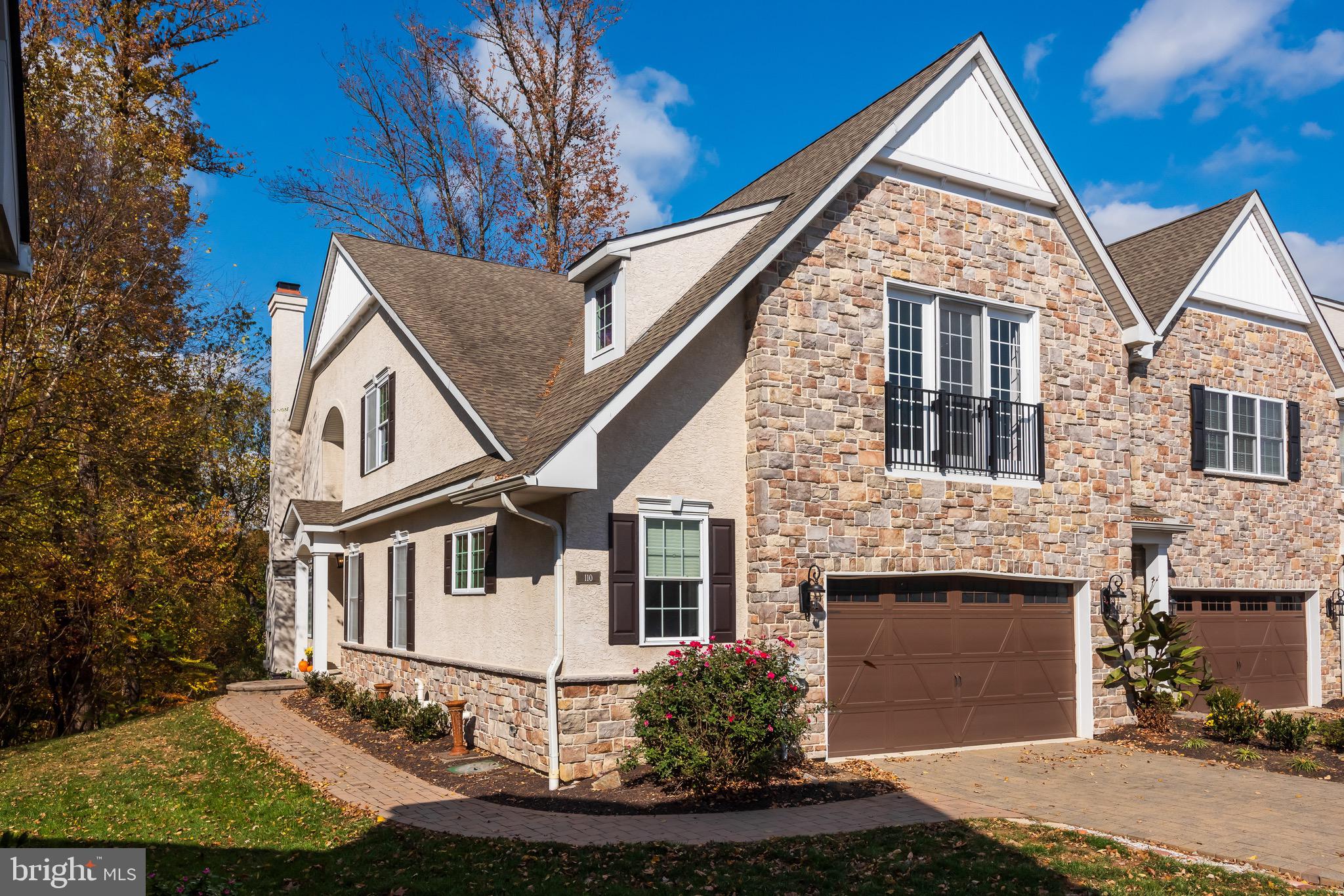 110 Dauphin Drive Springfield, PA 19064 - Photo 2 of 52 a front view of a house with a yard garage and outdoor seating