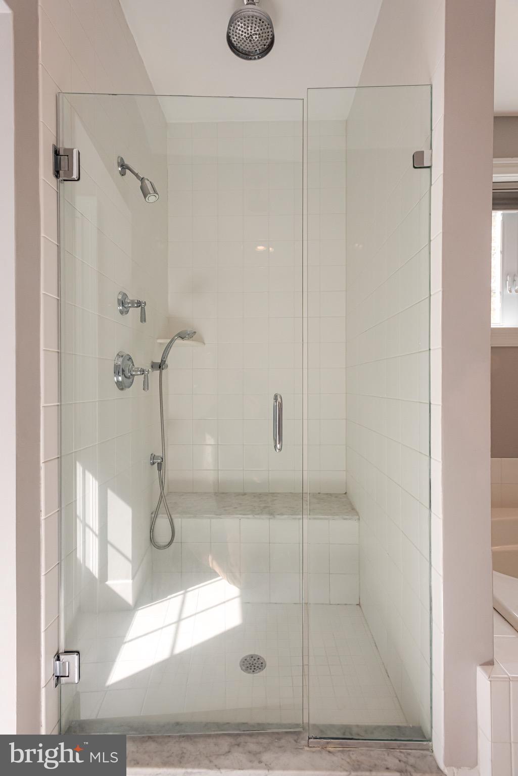 110 Dauphin Drive Springfield, PA 19064 - Photo 23 of 52 a bathroom with a glass shower door