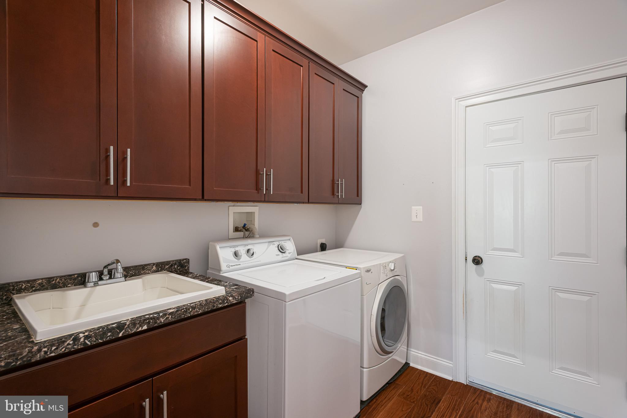 110 Dauphin Drive Springfield, PA 19064 - Photo 25 of 52 a utility room with dryer and washer