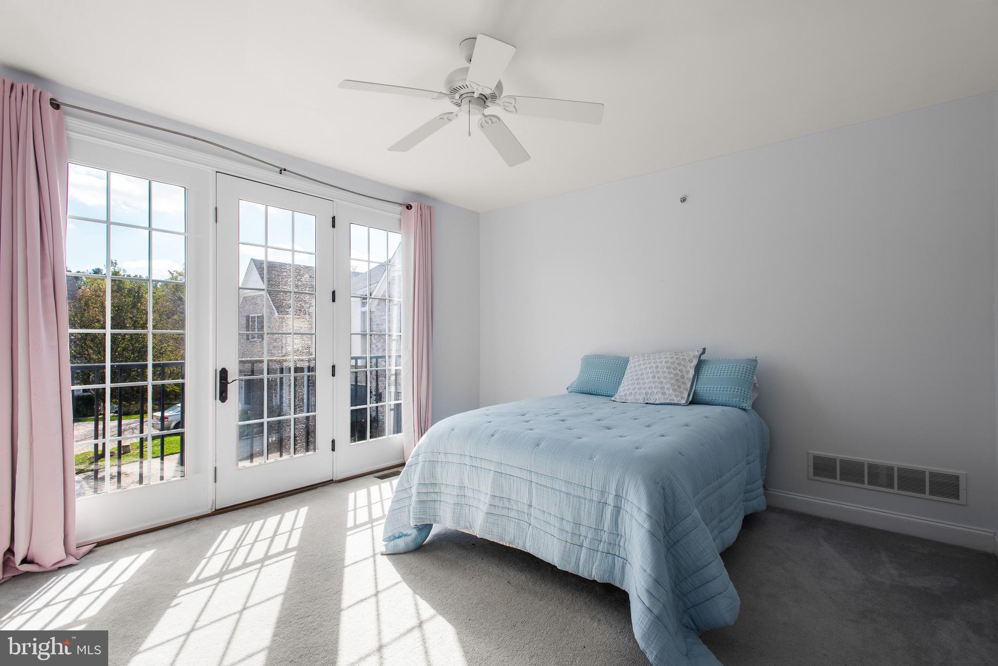 110 Dauphin Drive Springfield, PA 19064 - Photo 29 of 52 a bedroom with a bed and a large window
