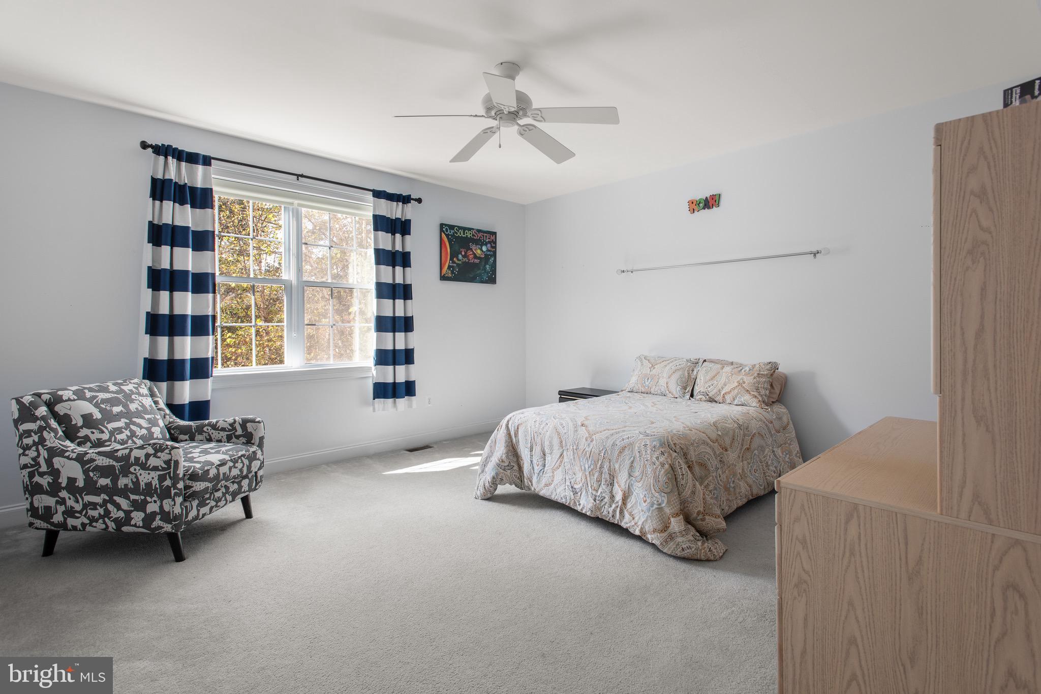 110 Dauphin Drive Springfield, PA 19064 - Photo 31 of 52 a spacious bedroom with a bed and a couch