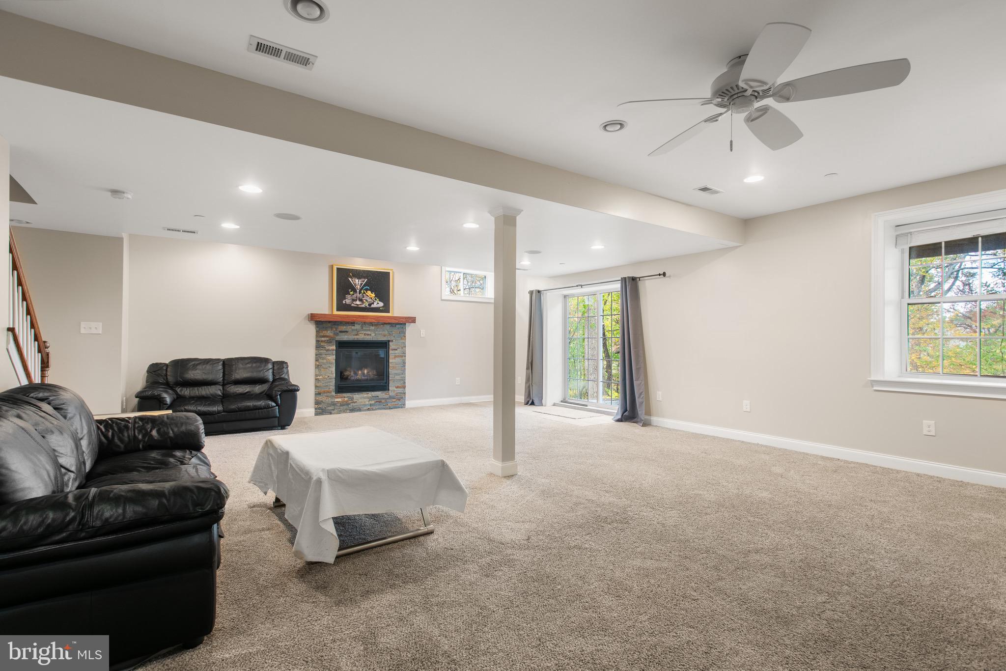 110 Dauphin Drive Springfield, PA 19064 - Photo 38 of 52 a living room with furniture and a fireplace