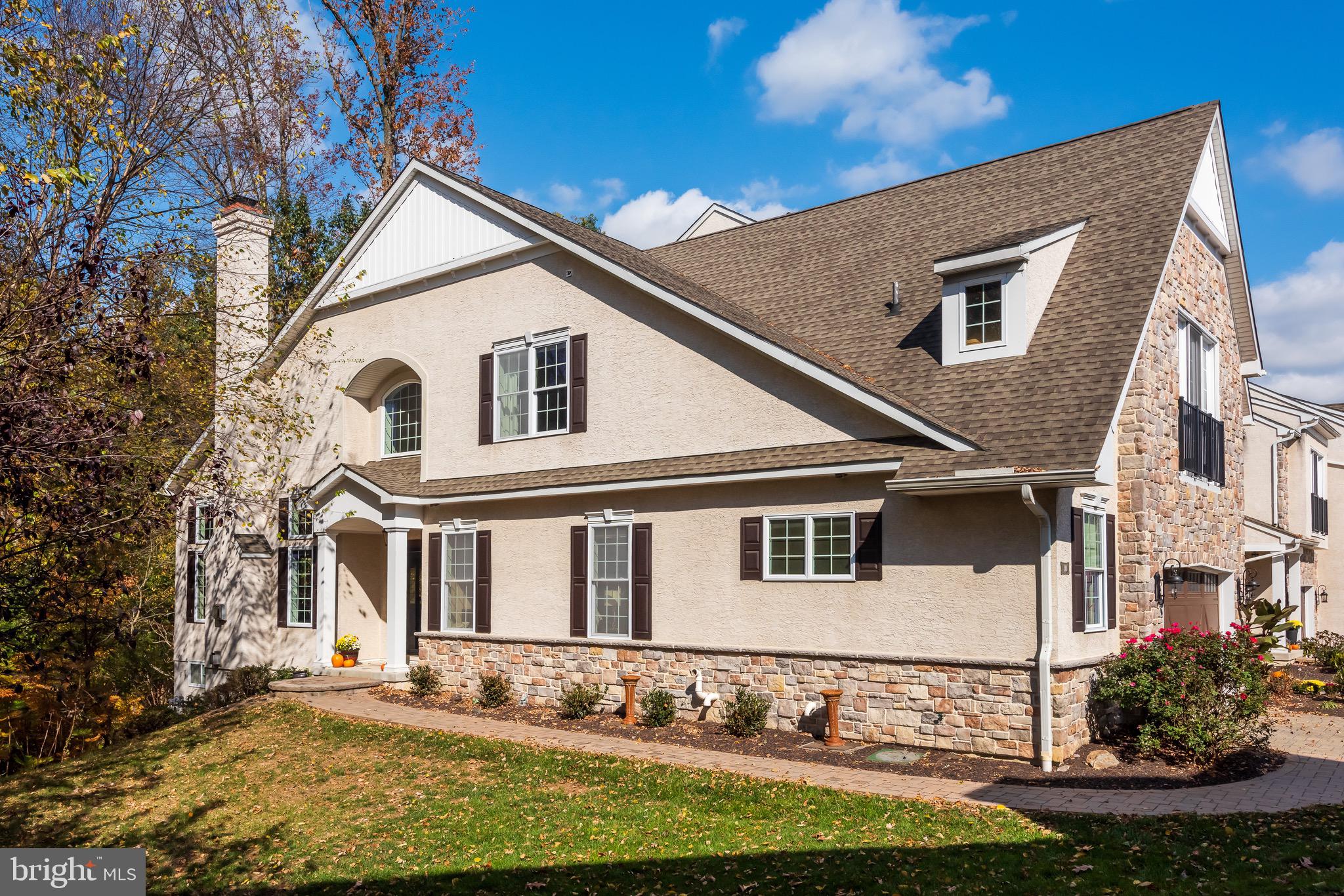 110 Dauphin Drive Springfield, PA 19064 - Photo 51 of 52 a view of a white house with large windows and a small yard