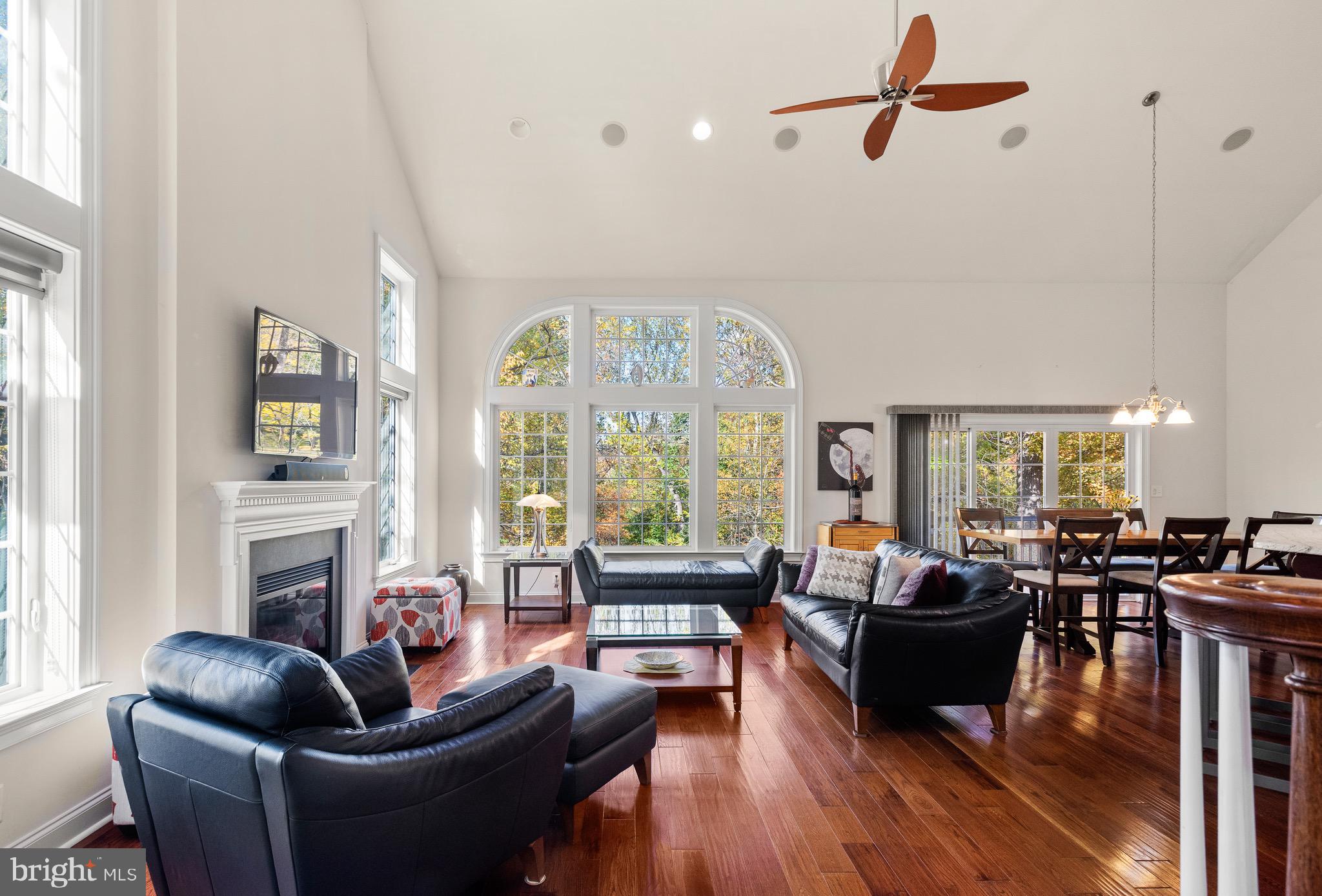 110 Dauphin Drive Springfield, PA 19064 - Photo 6 of 52 a living room with furniture fireplace and a large window