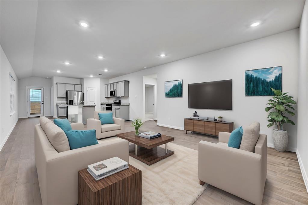 Living room featuring light wood-style flooring and recessed lighting