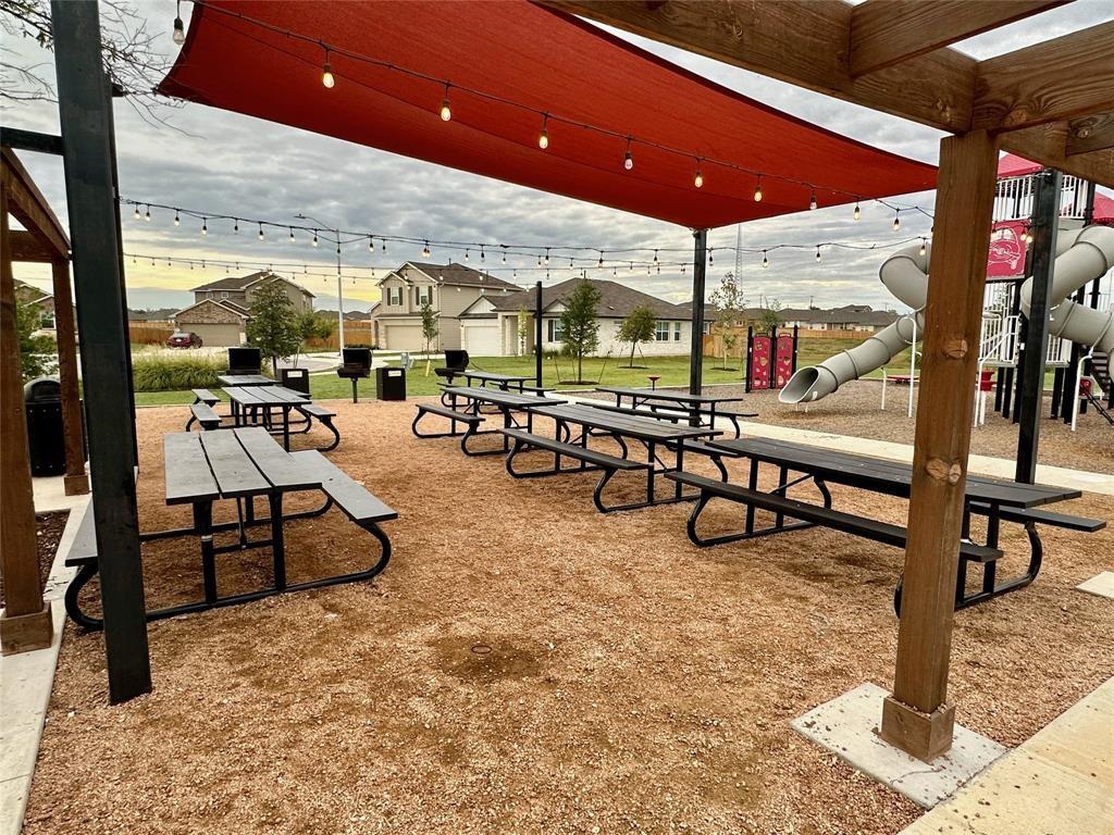 295 Evergreen Sumac Loop Kyle, TX 78640 - Photo 27 of 30 View of home's community featuring a patio