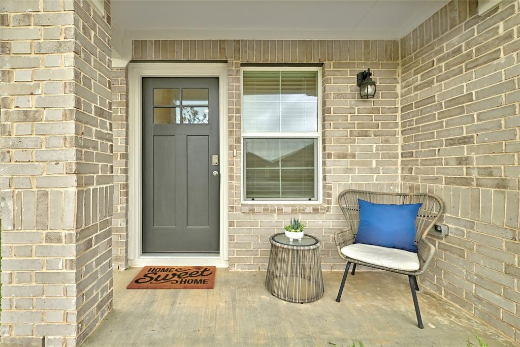 295 Evergreen Sumac Loop Kyle, TX 78640 - Photo 3 of 30 Doorway to property with brick siding