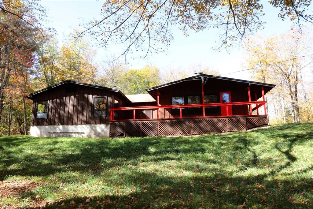 8 Thayer Road Monroe, MA 01247 - Photo 12 of 40 a view of a house with a yard porch and sitting area