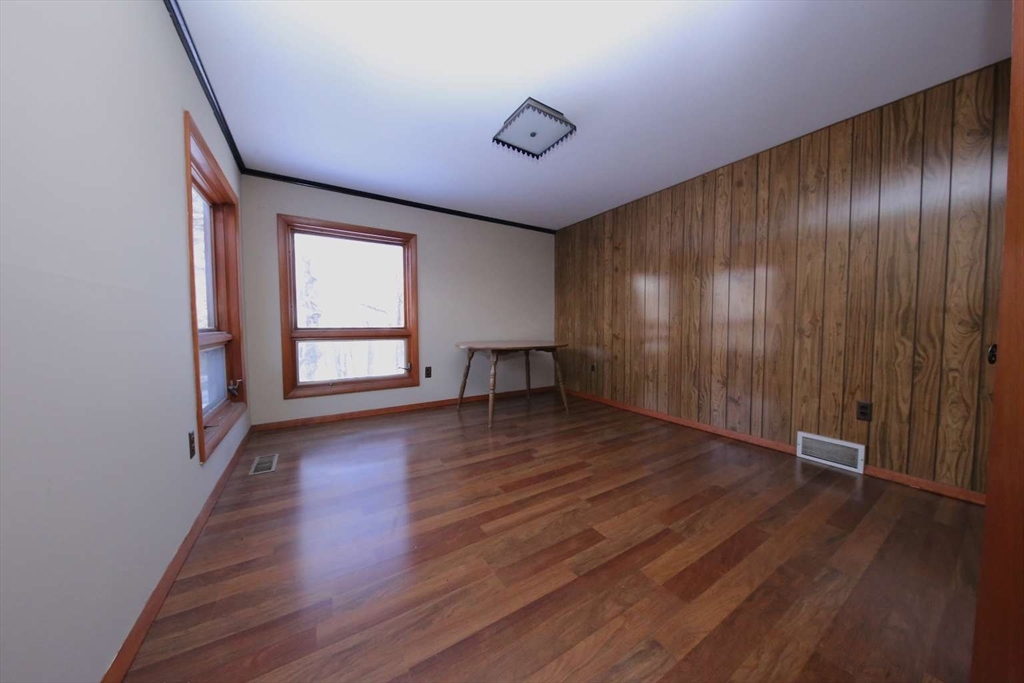 8 Thayer Road Monroe, MA 01247 - Photo 21 of 40 an empty room with wooden floor and windows