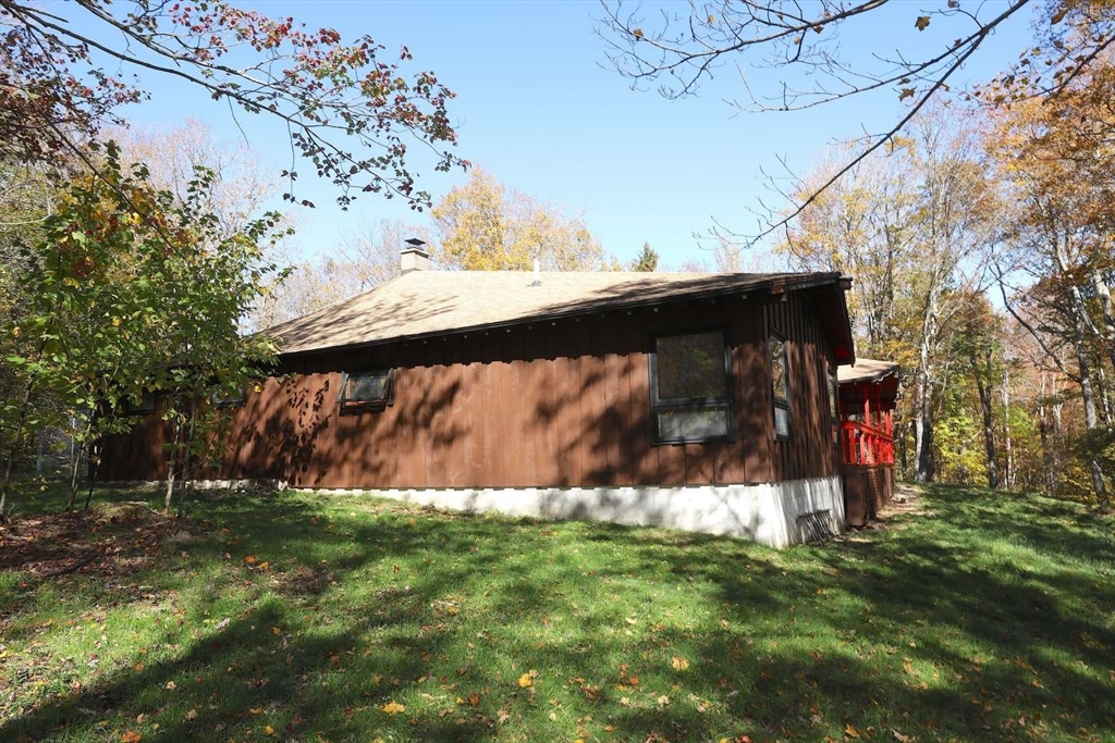 8 Thayer Road Monroe, MA 01247 - Photo 33 of 40 a view of a house with a yard