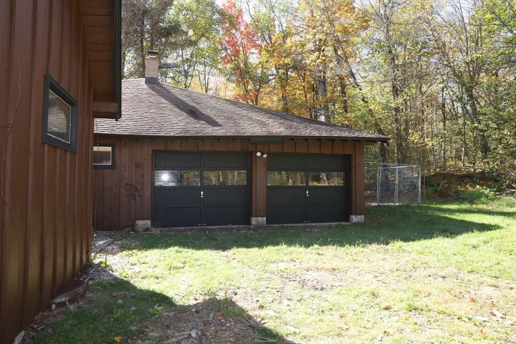 8 Thayer Road Monroe, MA 01247 - Photo 38 of 40 a front view of a house with a yard