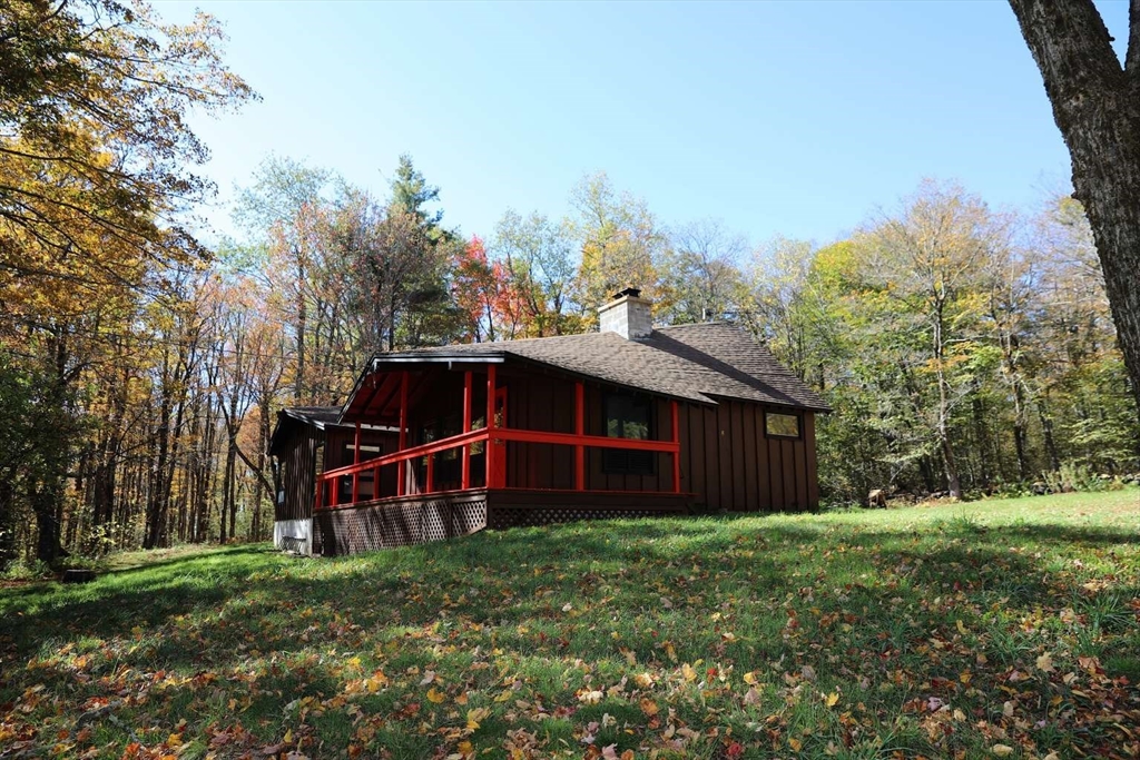 8 Thayer Road Monroe, MA 01247 - Photo 5 of 40 a view of a house with a yard and large trees