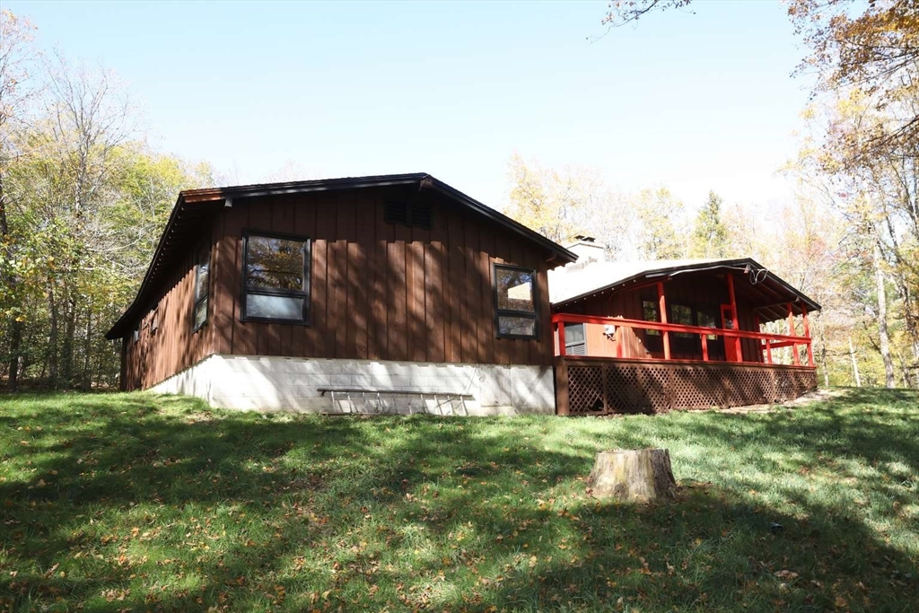 8 Thayer Road Monroe, MA 01247 - Photo 6 of 40 a front view of house with yard and trees