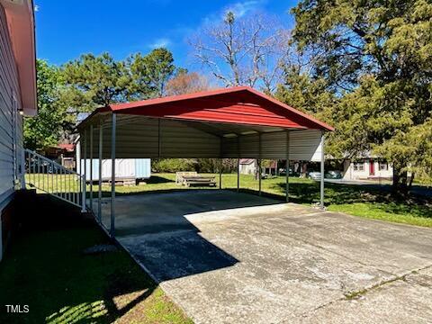 543 Stockyard Road Staley, NC 27355 - Photo 2 of 11 a view of a house with backyard and sitting area