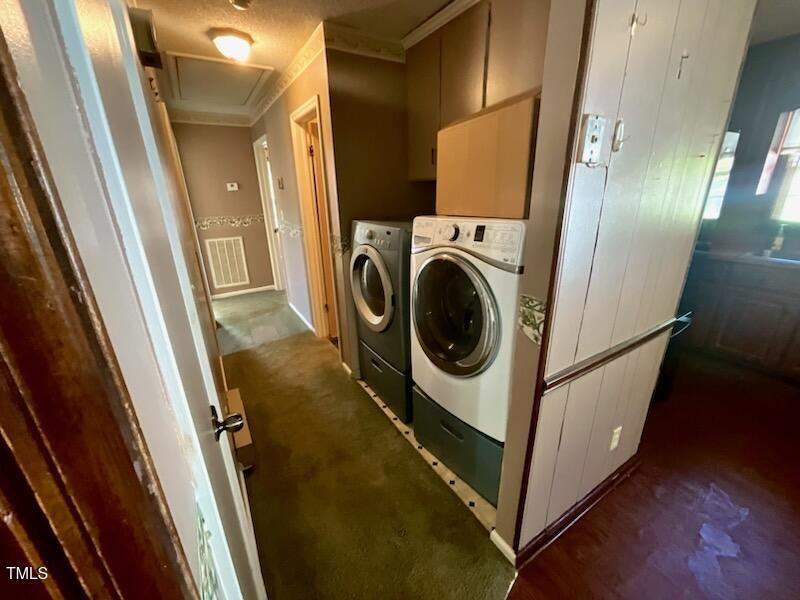 543 Stockyard Road Staley, NC 27355 - Photo 5 of 11 a utility room with wooden floor and washer