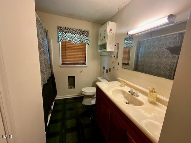 543 Stockyard Road Staley, NC 27355 - Photo 6 of 11 a bathroom with a sink and a mirror