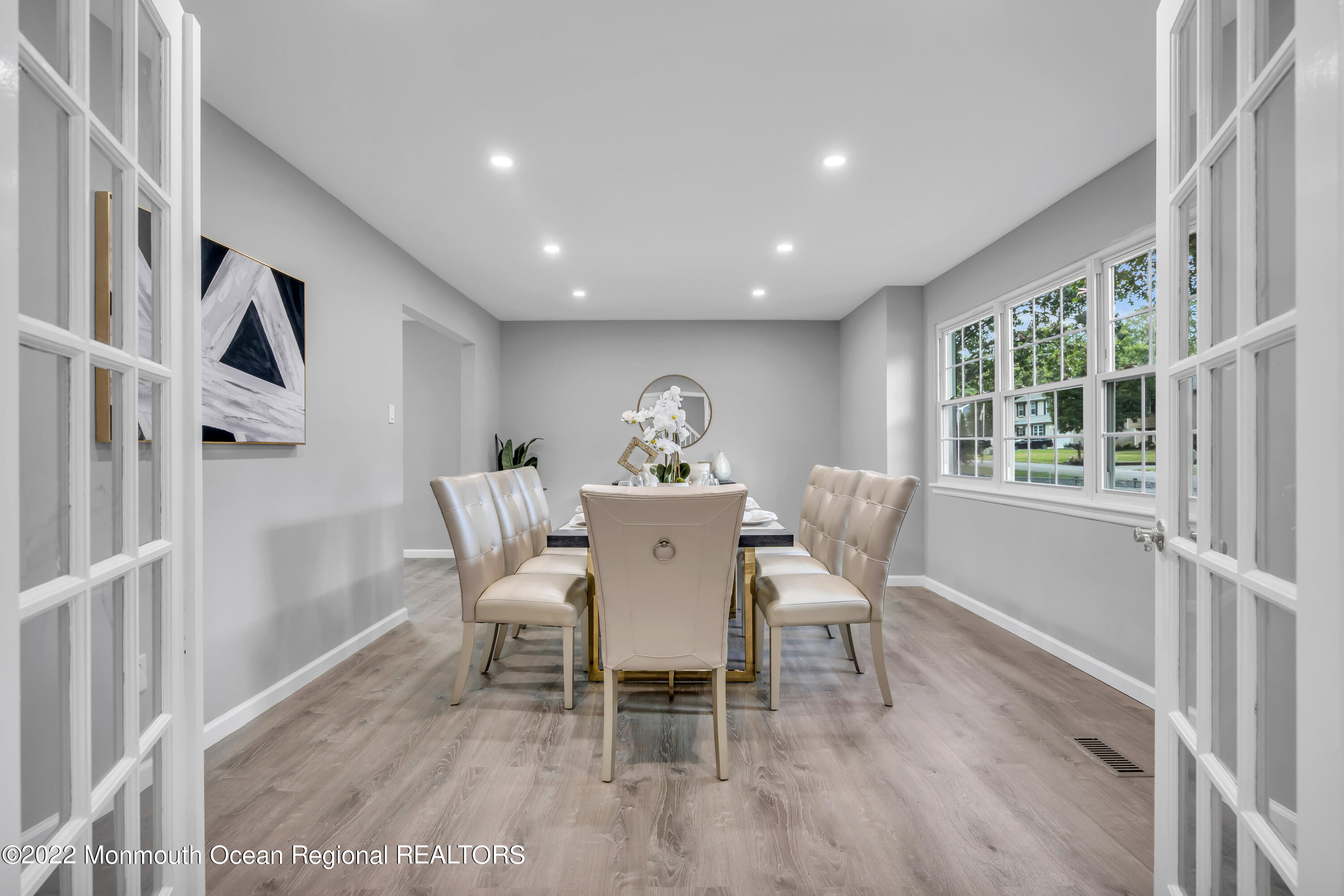 2440 Steiner Road Manchester Township, NJ 08759 - Photo 15 of 59 a dining room with furniture a window and a chandelier