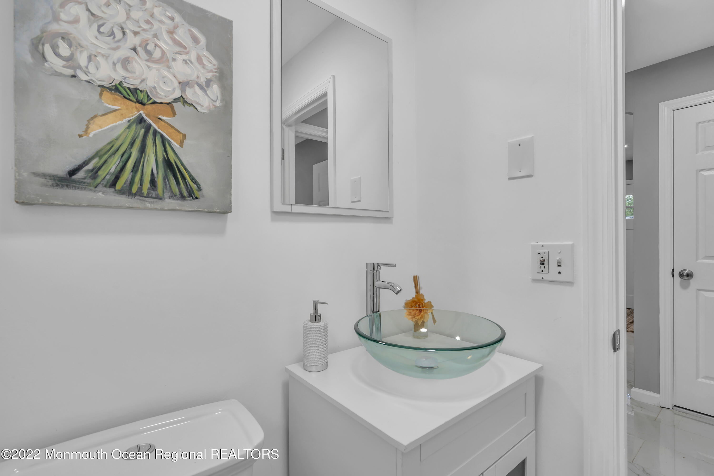 2440 Steiner Road Manchester Township, NJ 08759 - Photo 21 of 59 a bathroom with a sink and a mirror