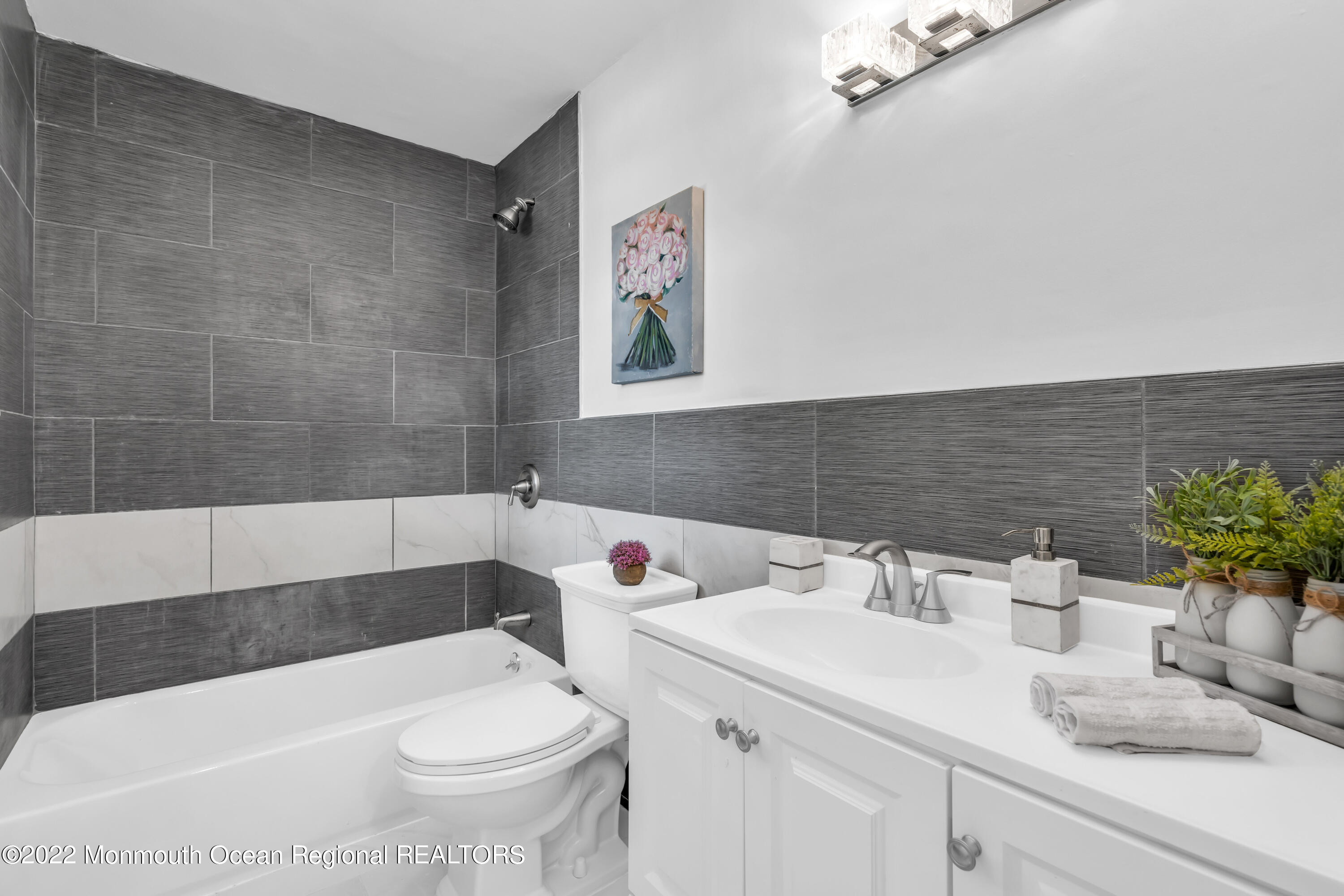 2440 Steiner Road Manchester Township, NJ 08759 - Photo 37 of 59 a bathroom with a sink and a mirror