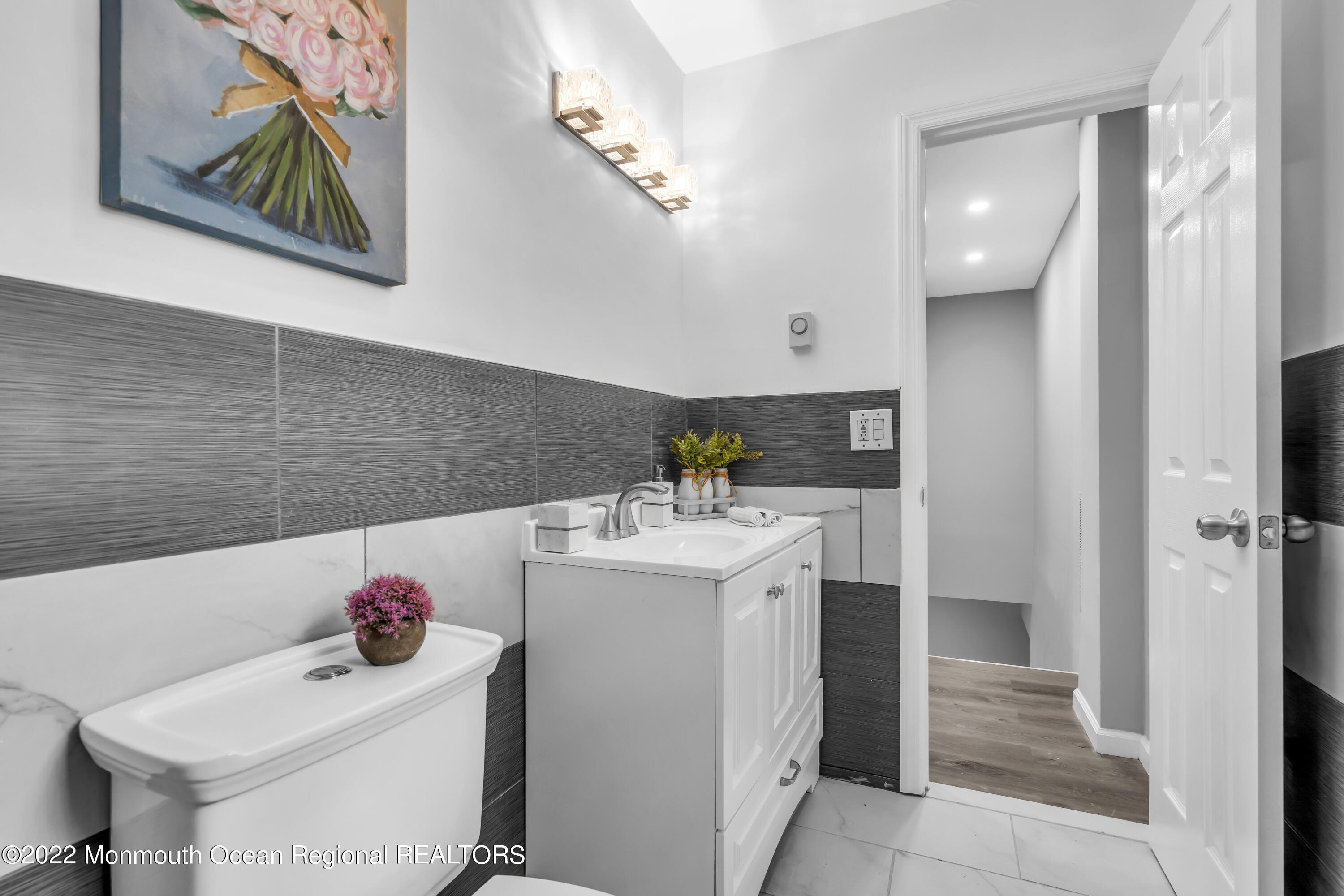 2440 Steiner Road Manchester Township, NJ 08759 - Photo 40 of 59 a bathroom with a sink vanity and tub