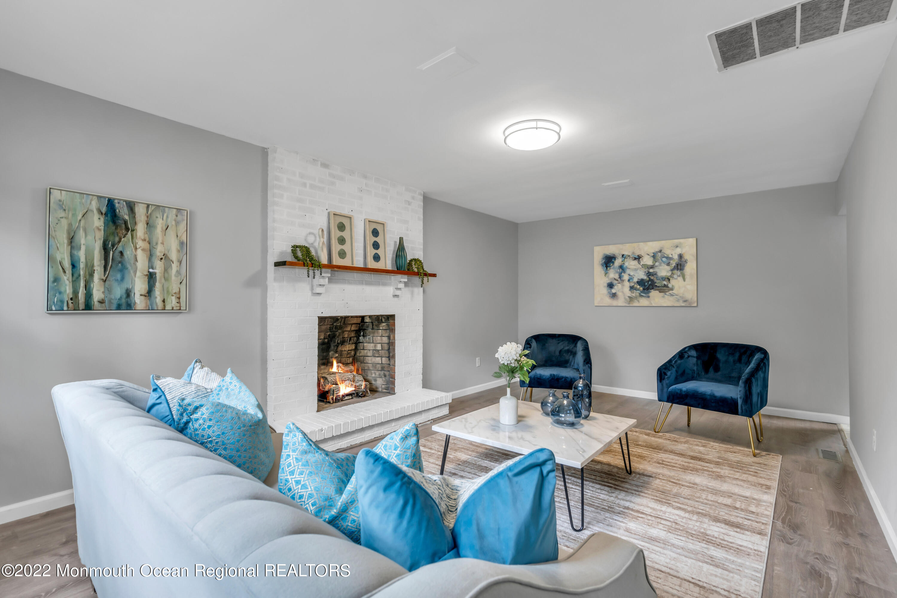 2440 Steiner Road Manchester Township, NJ 08759 - Photo 7 of 59 a living room with furniture and a fireplace